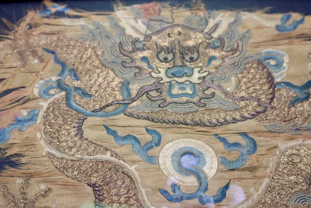 A Chinese Qing dynasty embroidered silk dragon fragment, possibly Imperial, framed, 22 x 28cm